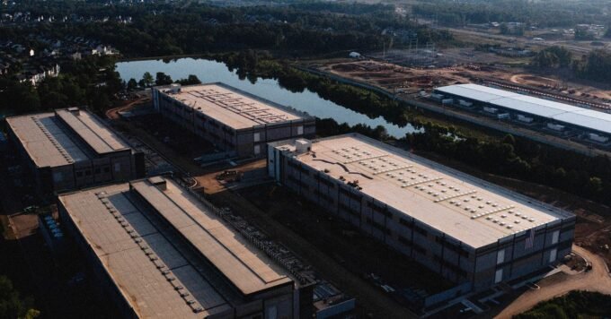 An illustration depicting data center servers with an overlay of a power grid or environmental elements, symbolizing the debate around their impact.