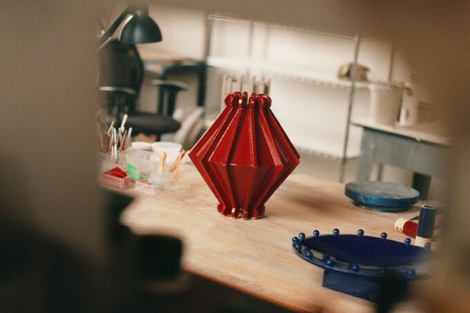 Joseph Sgambati III presenting his 'Take 5' design favorites, featuring colorful objects, ceramic art, and stylish seating.