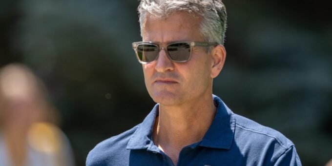 Josh D'Amaro, new CEO of Walt Disney Company, with Disney castle in background