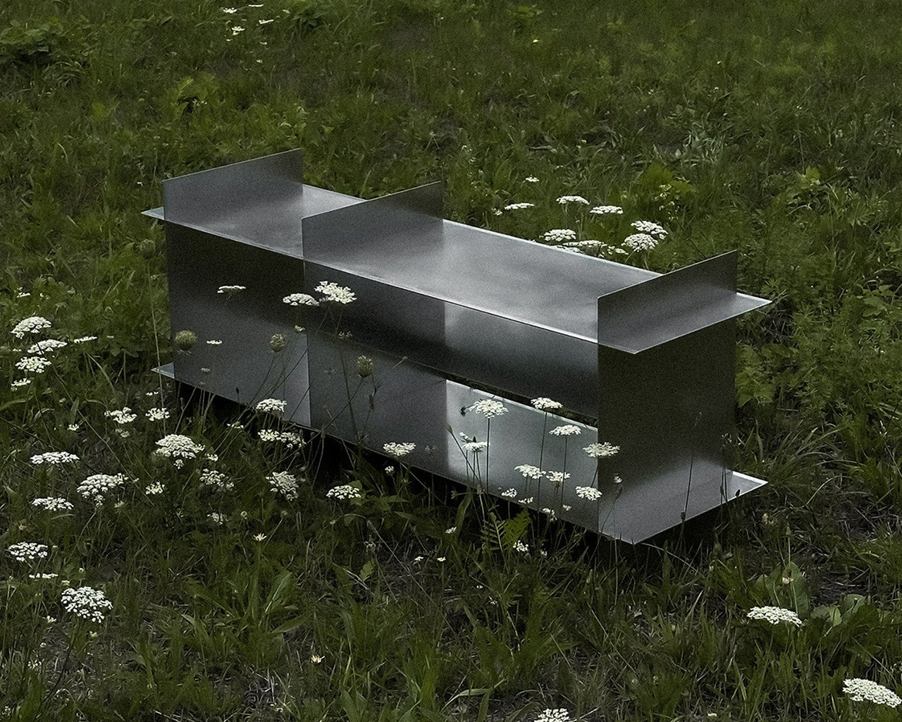 Dot Objects Grid Shelving Unit in a minimalist interior setting, showcasing its clean lines and steel construction.