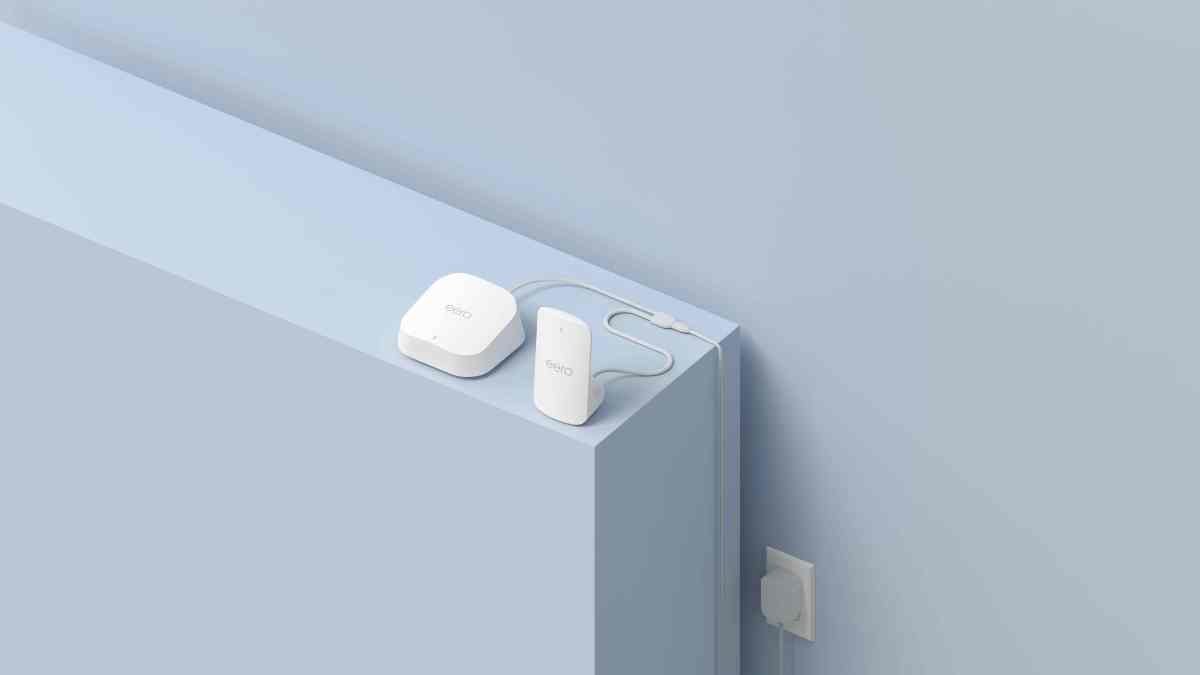 Amazon eero Signal 4G LTE device plugged into an eero Wi-Fi router, providing cellular internet backup.