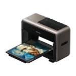 The eufyMake E1 UV Printer in a home workshop, showcasing its compact design and the vibrant results of its 3D texture printing capability.