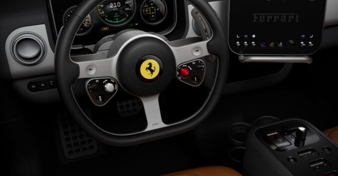 Interior view of the Ferrari Luce electric supercar, showcasing Jony Ive's design with multiple screens, physical buttons, and premium materials like Gorilla Glass and aluminum.