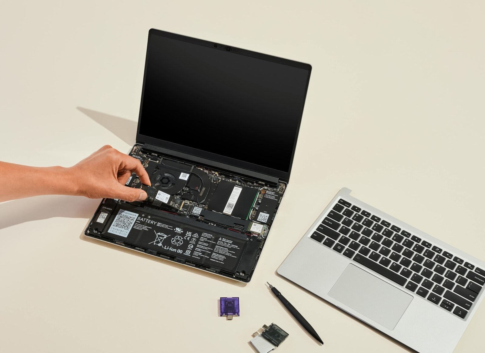 The Framework Laptop 13: A Modular Marvel Challenging Planned Obsolescence 3 A sleek Framework Laptop 13 open on a desk, showcasing its customizable ports and screen.