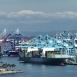 Global Trade on Edge: EU Halts US Deal Amid Renewed Tariff Turmoil 6 A gavel striking a block with trade charts in the background, symbolizing legal decisions impacting global commerce and market volatility.