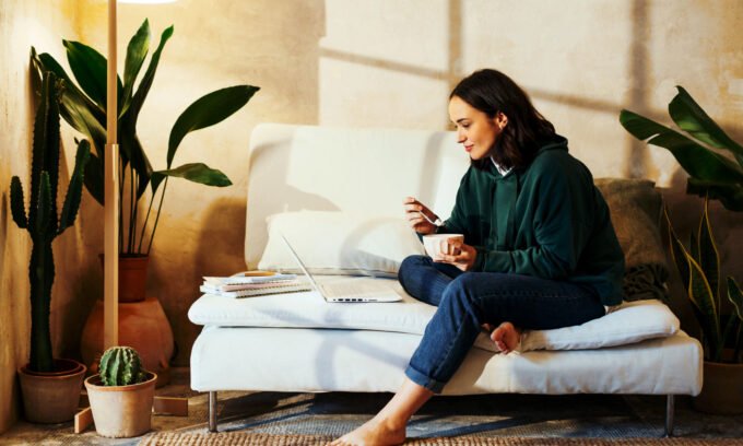 Beyond the Bloat: My Journey to Digestive Harmony with a Fiber & Probiotics Blend 6 A journalist smiling, holding a glass of a watermelon-flavored drink, representing improved gut health and wellness.