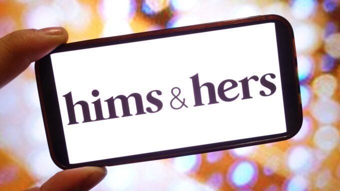 Hims & Hers logo with a blurred image of a weight-loss pill or a legal document in the background, symbolizing the controversy.
