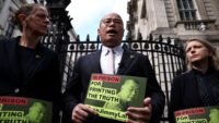 Sebastian Lai, son of jailed Hong Kong pro-democracy media tycoon Jimmy Lai, speaks to the press outside Downing Street in London.