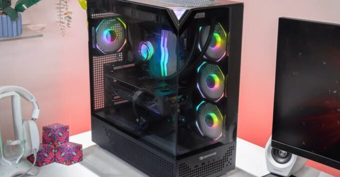 Two iBuyPower gaming desktops with RGB lighting and tempered glass panels