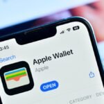 iPhone screen displaying Apple Wallet's credit card autofill options during an online purchase.