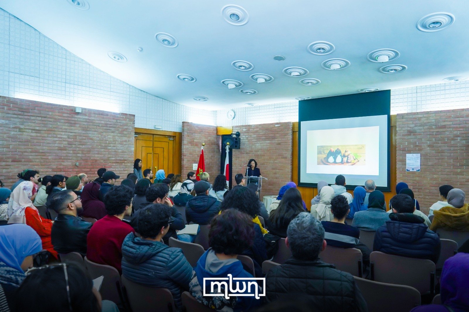 Attendees and speakers at the Japanese cultural conference in Rabat, discussing the global impact of Japanese culture.