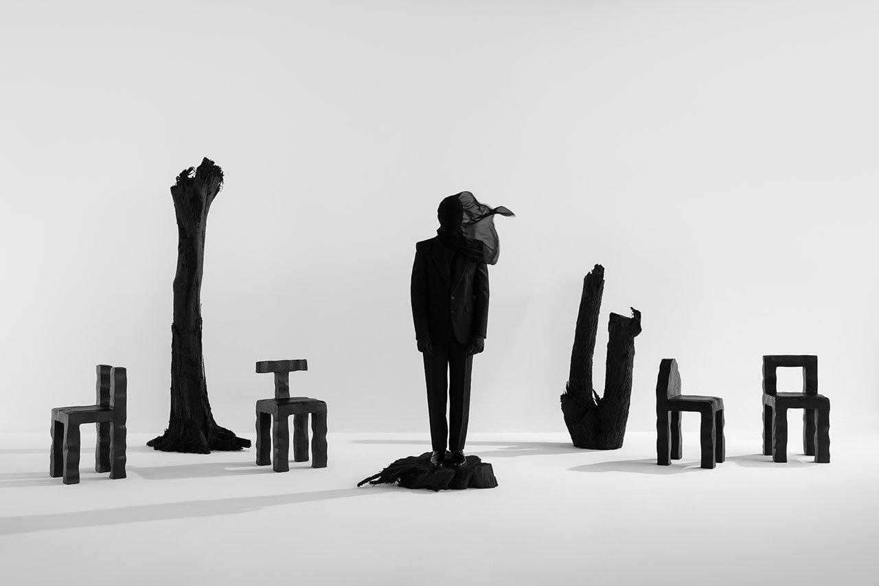 Kameh, the enigmatic designer, showcasing a unique, soulful design piece.