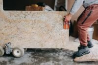 Various kitchen countertop materials including quartz, granite, and ultracompact stone