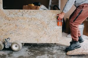 Various kitchen countertop materials including quartz, granite, and ultracompact stone