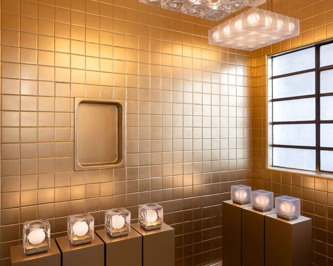 Lee Broom's 'The Resident': A Luminous Debut in Mexico City 6 A dramatic view of Lee Broom's Hail Chandelier descending through the central atrium of the Diez Company house in Mexico City, as part of 'The Resident' exhibition.