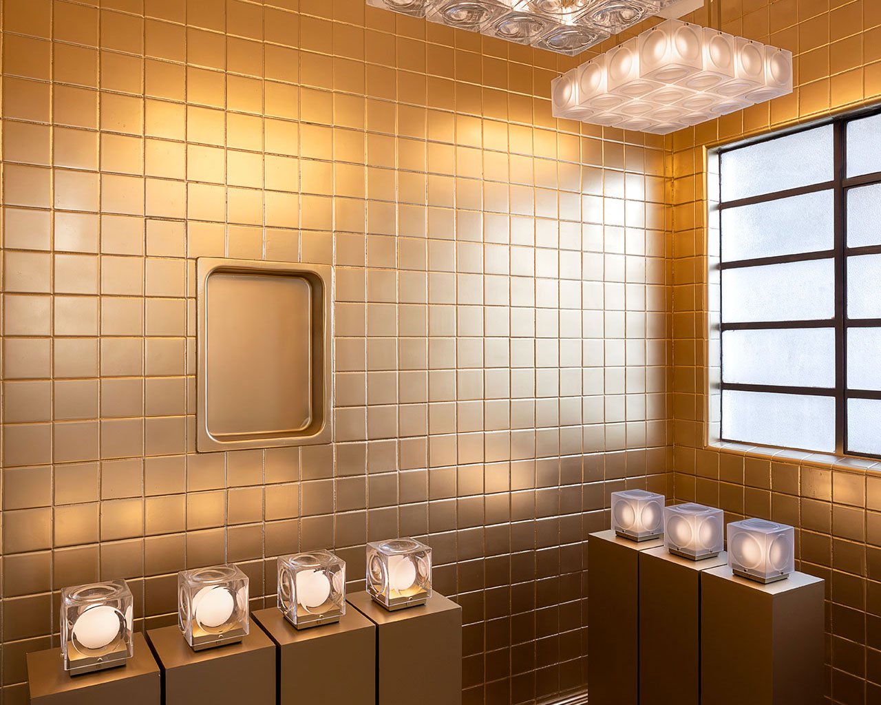 A dramatic view of Lee Broom's Hail Chandelier descending through the central atrium of the Diez Company house in Mexico City, as part of 'The Resident' exhibition.