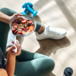 Illustration of a human liver with gears or a clock superimposed, symbolizing its internal circadian rhythm, alongside healthy food items.