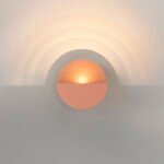 Maarten De Ceulaer's Impulse Collection light fixture casting layered shadows on a wall.