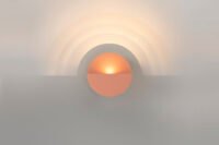 Maarten De Ceulaer's Impulse Collection light fixture casting layered shadows on a wall.