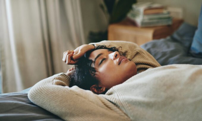 A serene image of a person sleeping soundly, illustrating the importance of restful sleep and the potential role of magnesium.