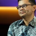 Malaysia's Economy Minister Akmal Nasrullah Mohd Nasir speaking at a summit, symbolizing economic leadership and strategic planning.