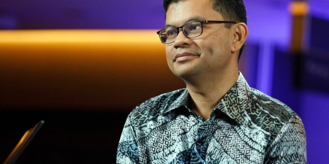 Malaysia's Economy Minister Akmal Nasrullah Mohd Nasir speaking at a summit, symbolizing economic leadership and strategic planning.