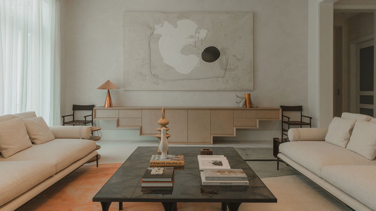 A serene living space in Marcela Cure's Pinecrest Miami home, featuring soft neutrals, natural materials, and abundant natural light.