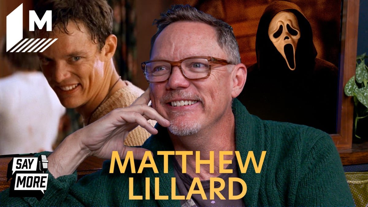 Matthew Lillard smiling during an interview, hinting at his return to the Scream franchise.