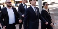 Mark Zuckerberg's entourage wearing Meta AI glasses in a Los Angeles courtroom during a social media addiction trial.