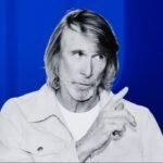 Michael Bay, director, and a Cadillac vehicle, symbolizing the lawsuit over the Super Bowl ad.