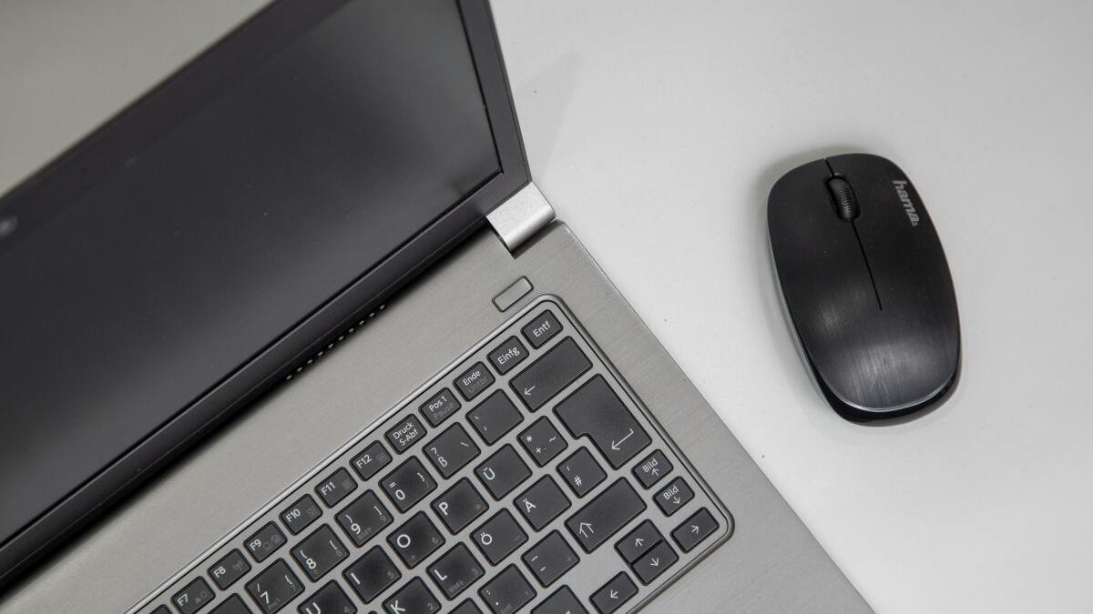 Microsoft Office Home & Business 2021 applications displayed on a MacBook screen