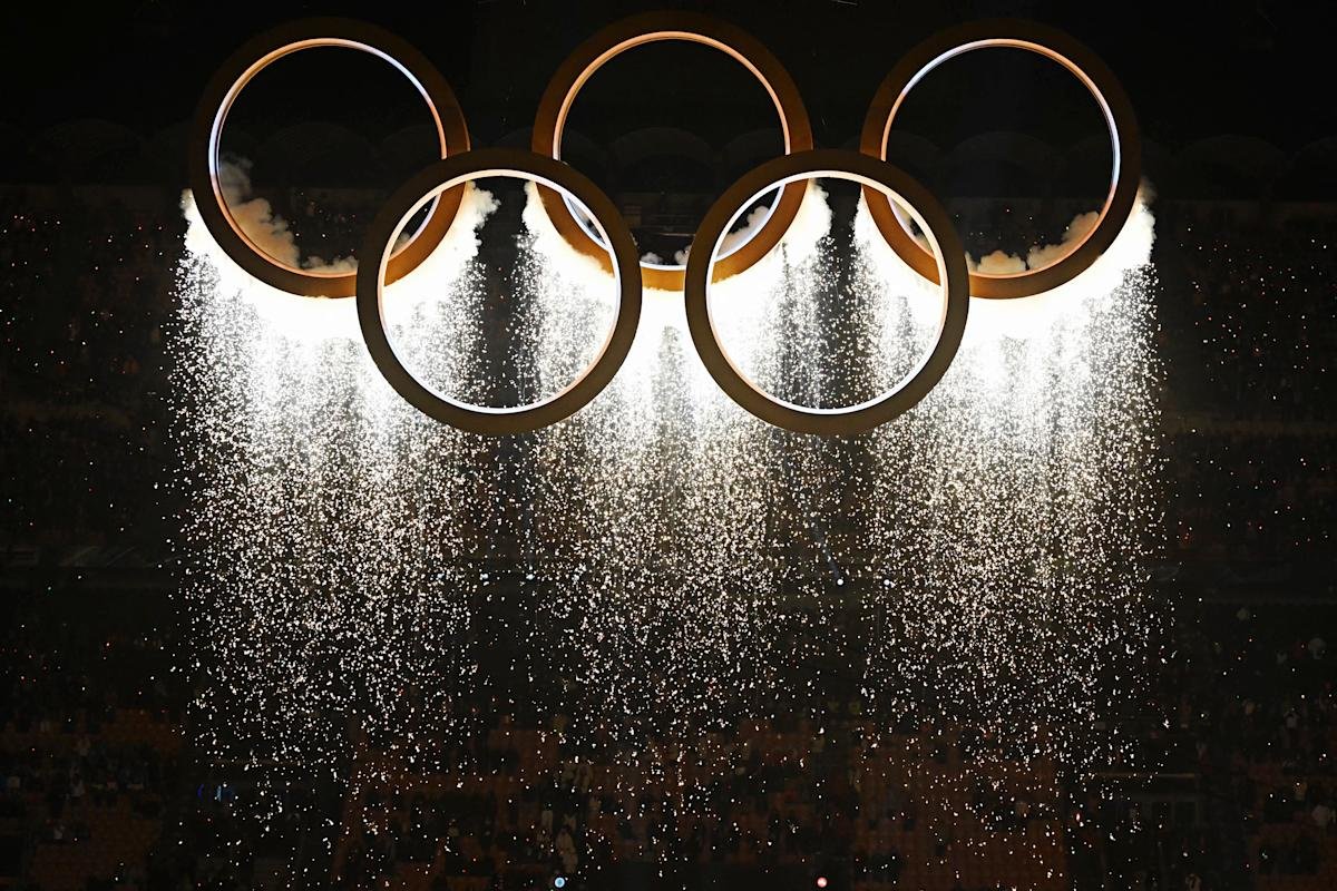 Panoramic view of San Siro Stadium during the Milan Cortina 2026 Winter Olympics Opening Ceremony with fireworks and athletes