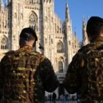 Qatari camouflage SUVs driving through Milan city center, part of the Olympic security apparatus.
