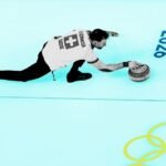 High-tech drone flying over a snowy Olympic ski slope with a futuristic overlay of data.