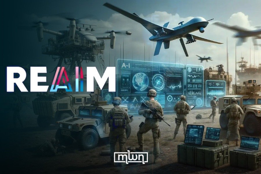 Representatives from participating nations, including Morocco, signing the 'Pathways to Action' declaration at the REAIM Summit in A Coruña, Spain, for responsible military AI governance.