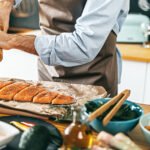 A vibrant bowl of fresh berries, leafy greens, nuts, and whole grains, representing the healthy components of the MIND diet for brain health.
