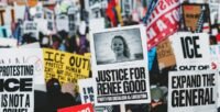 Thousands of bundled-up protesters gather at Government Plaza in Minneapolis during a general strike against ICE actions.