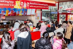 Beyond the Golden Arches: China's Mixue, the World's Largest Food Chain, Sets Sights on America 3 Mixue store exterior with Snow King mascot and bright red branding