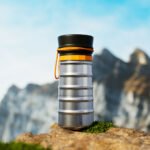 The MokaMax Portable Coffee Pot, a sleek, ribbed aluminum device for brewing fresh coffee on the go.