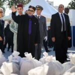 King Mohammed VI and Crown Prince Moulay El Hassan launching the Ramadan 1447 Solidarity Operation in Salé, Morocco, with food baskets and volunteers.
