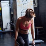 A person lifting weights, symbolizing muscle strength and diabetes prevention.