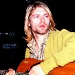 A collage of diverse musicians, some with guitars, microphones, or on stage, representing artists who never had a No. 1 song.