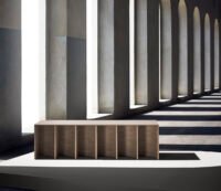 A sculptural installation featuring 'Layered Nature' wood veneers by nendo for ALPI, showcasing curved forms and delicate textures.
