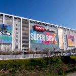 An NFL player in action on the field, with subtle digital overlays suggesting data analysis or AI integration.