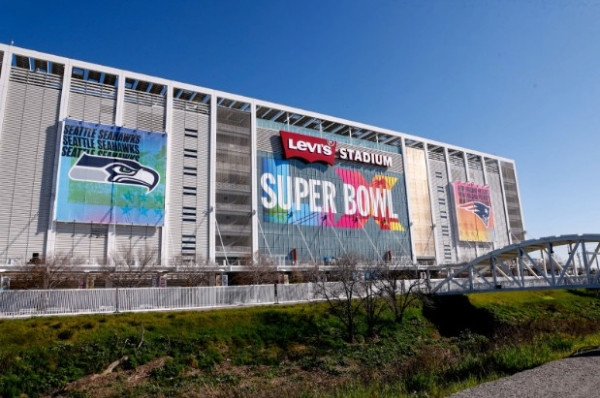 An NFL player in action on the field, with subtle digital overlays suggesting data analysis or AI integration.