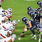 NFL's Global Playbook: A Record Season Paves the Way for Unprecedented International Expansion 6 NFL players in action during an international game, symbolizing the league's global expansion and reach.