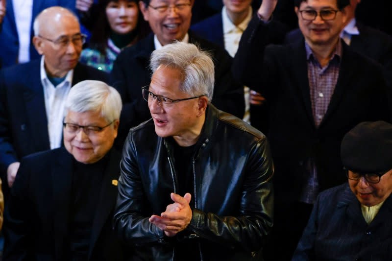 NVIDIA Reaffirms OpenAI Commitment Amidst Investment Speculation 3 NVIDIA CEO Jensen Huang speaking at a tech conference, with OpenAI logo in background.