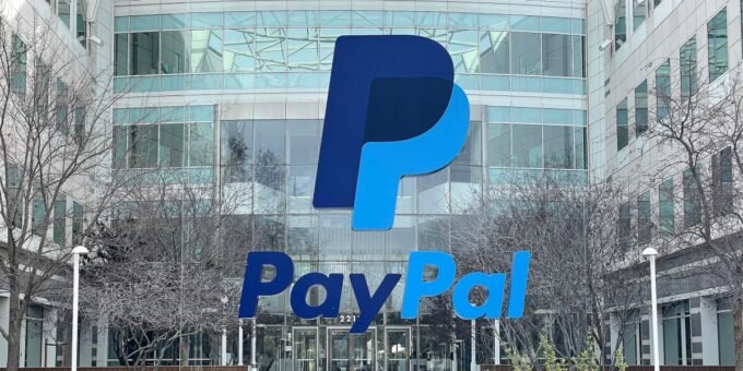 Jamie Miller, PayPal's interim CEO, standing in a corporate setting