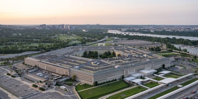 Illustration of a university campus with a subtle overlay of a Pentagon logo, symbolizing the intersection of academia and national security concerns.