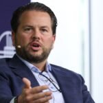 A stylized image of the Pinterest logo with a subtle overlay of a spreadsheet or data visualization, representing the layoff tracking tool and corporate data.